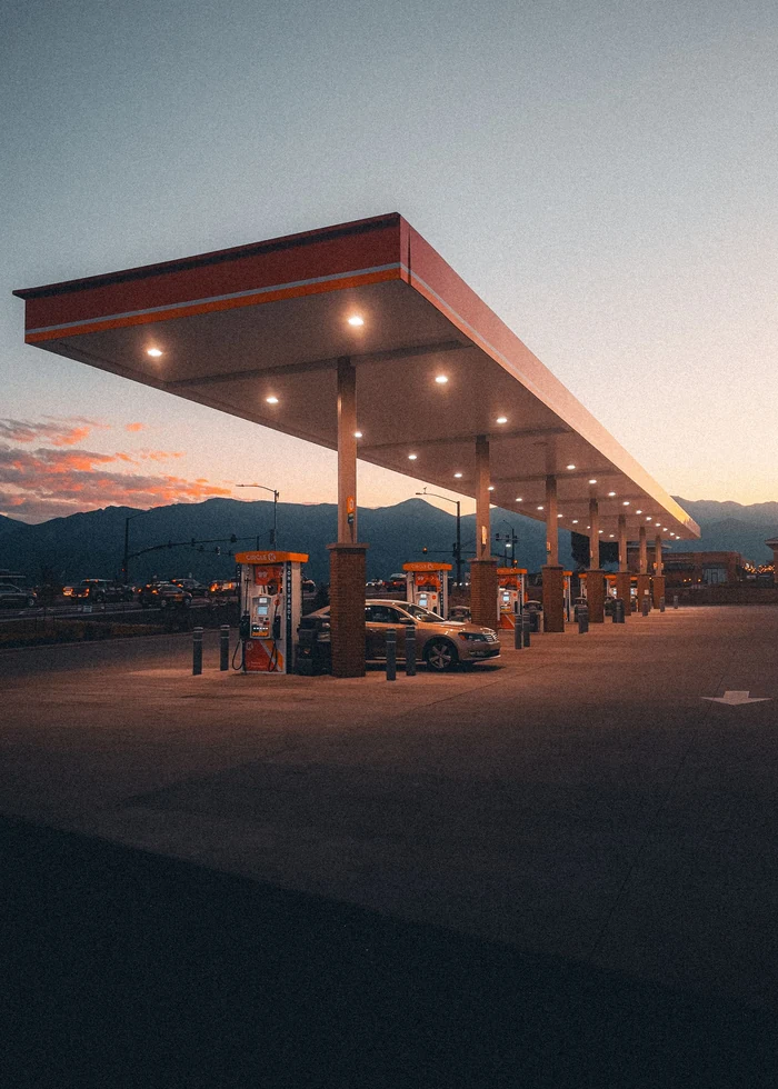 A gas station forecourt at dusk