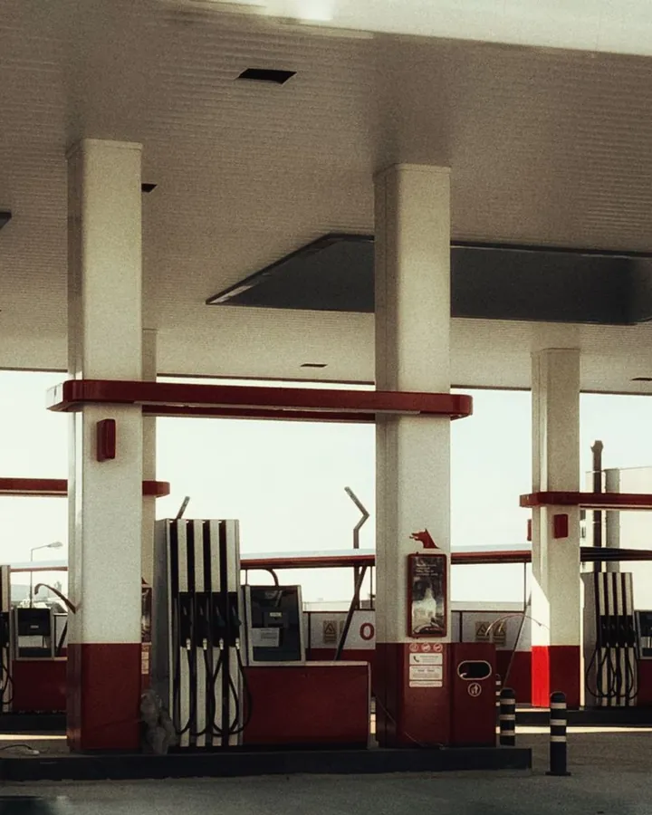 Fuel pumps under a gas station canopy